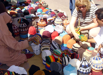 Bronwyn buying hats in Morocco